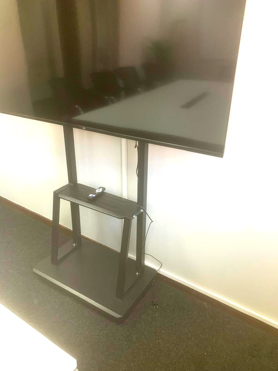 Boardroom display stand with a terminated network cable routed to the wall point